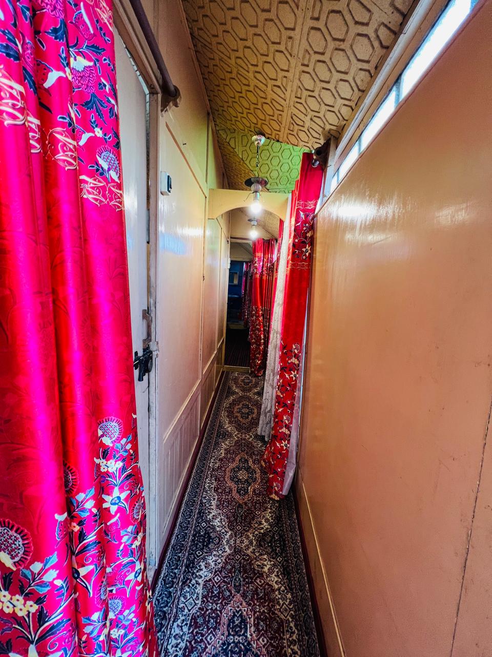 Corridor inside the houseboat with Kashmiri runner carpet
