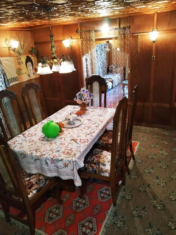 Houseboat dining room laid for a Kashmiri meal