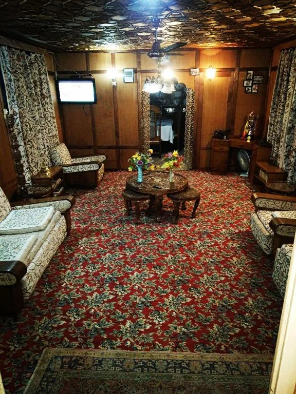 Drawing room aboard Young Snow View with hand-carved khatamband ceiling