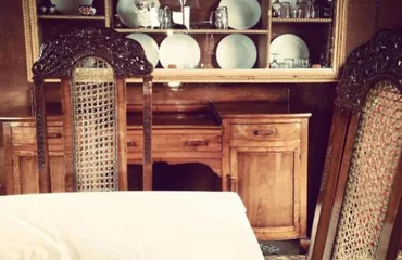 Hand-carved walnut cabinetry inside the houseboat